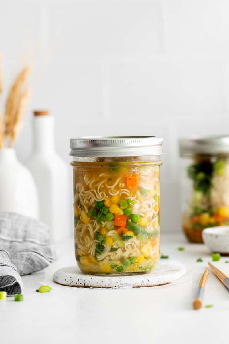 instant ramen noodles and veggies in broth, in a mason jar