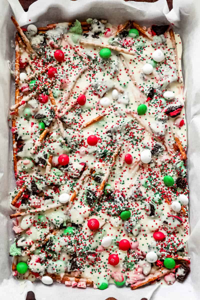baking sheet of white chocolate Christmas bark before breaking it up