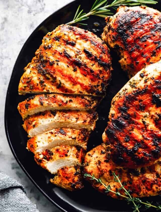 marinated grilled chicken breast sliced on a plate