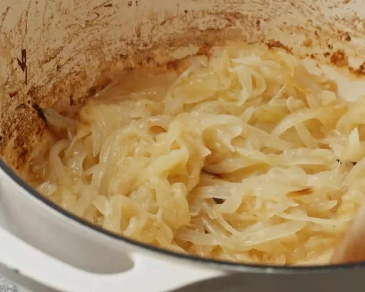 Lightly caramelized onions beginning to brown in a pot