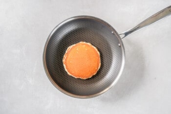 a cooked buttermilk pancake in a skillet.