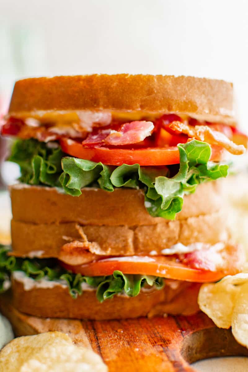 close up of 2 stacked blt sandwiches.