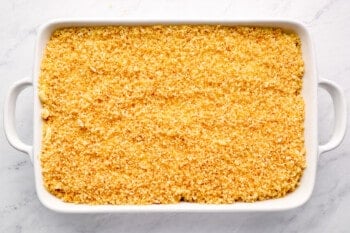 panko topped mac and cheese casserole in a white baking pan.