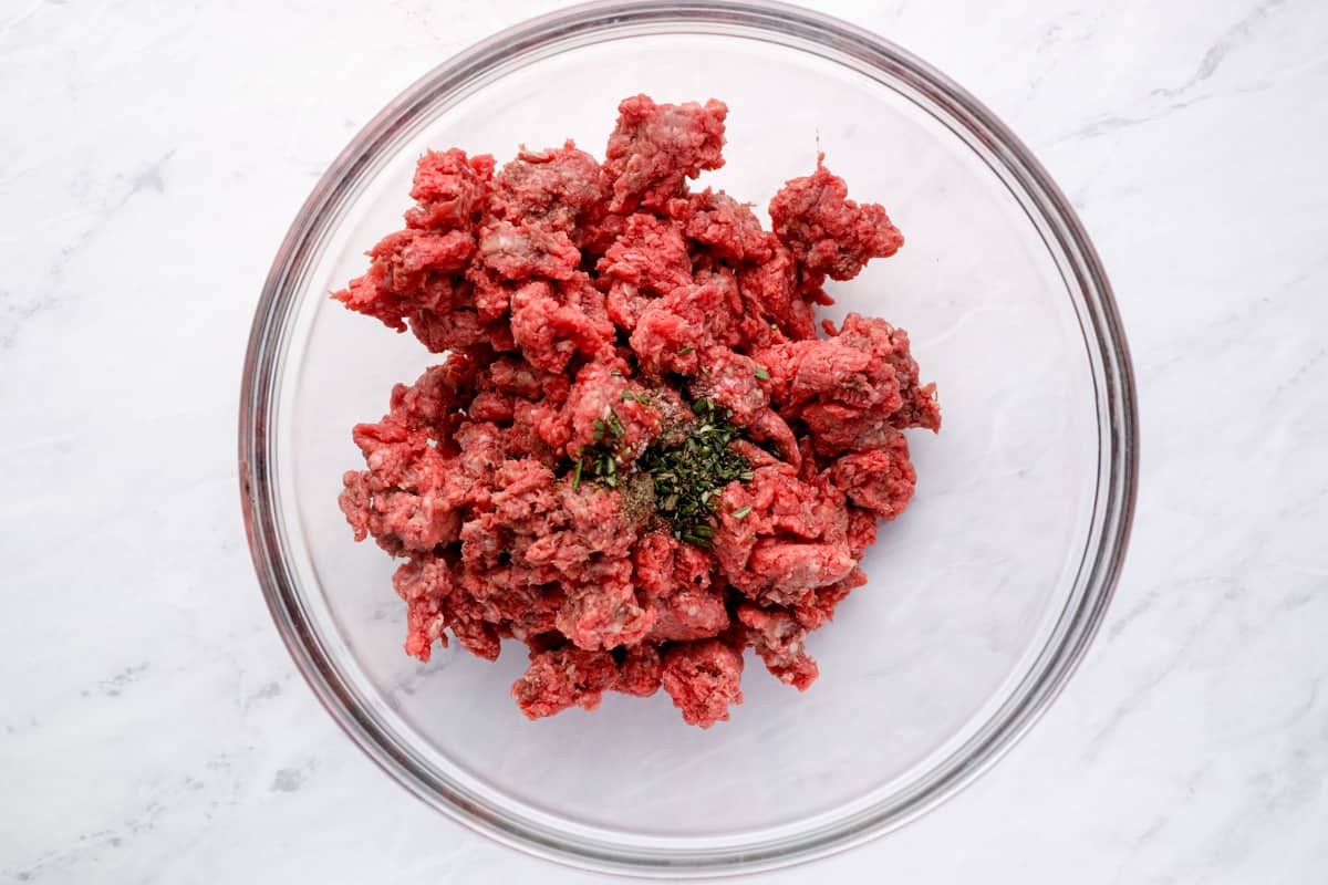 Seasoned ground beef in a mixing bowl.