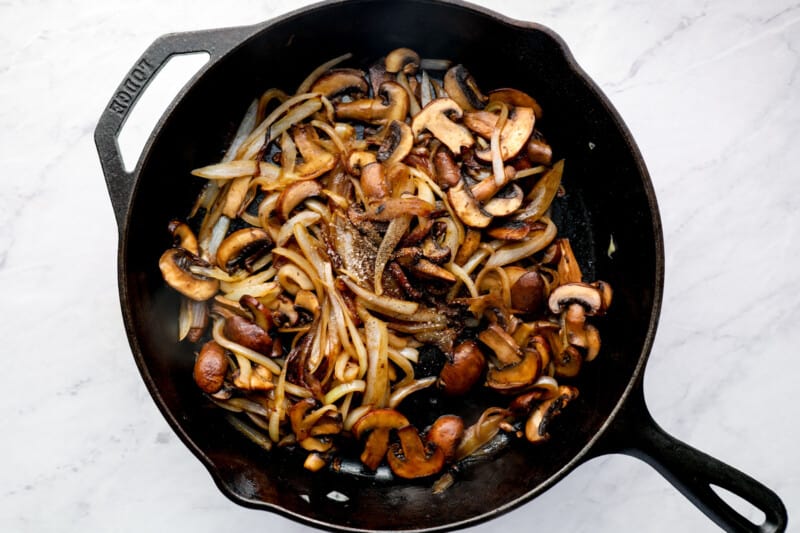 caramelizing mushrooms in a cast iron skillet