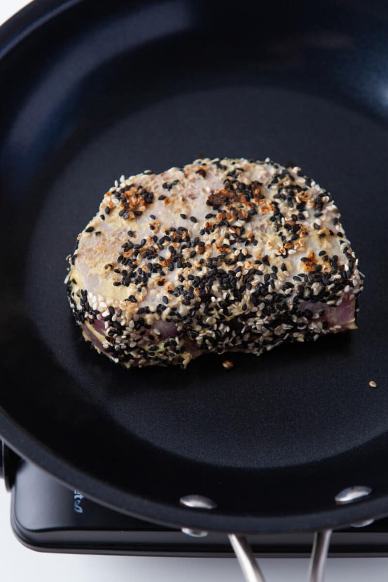 searing sesame coated Ahi Tuna steak