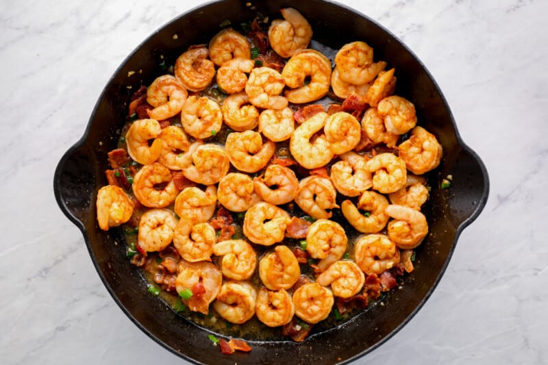 cooking cajun shrimp in a skillet