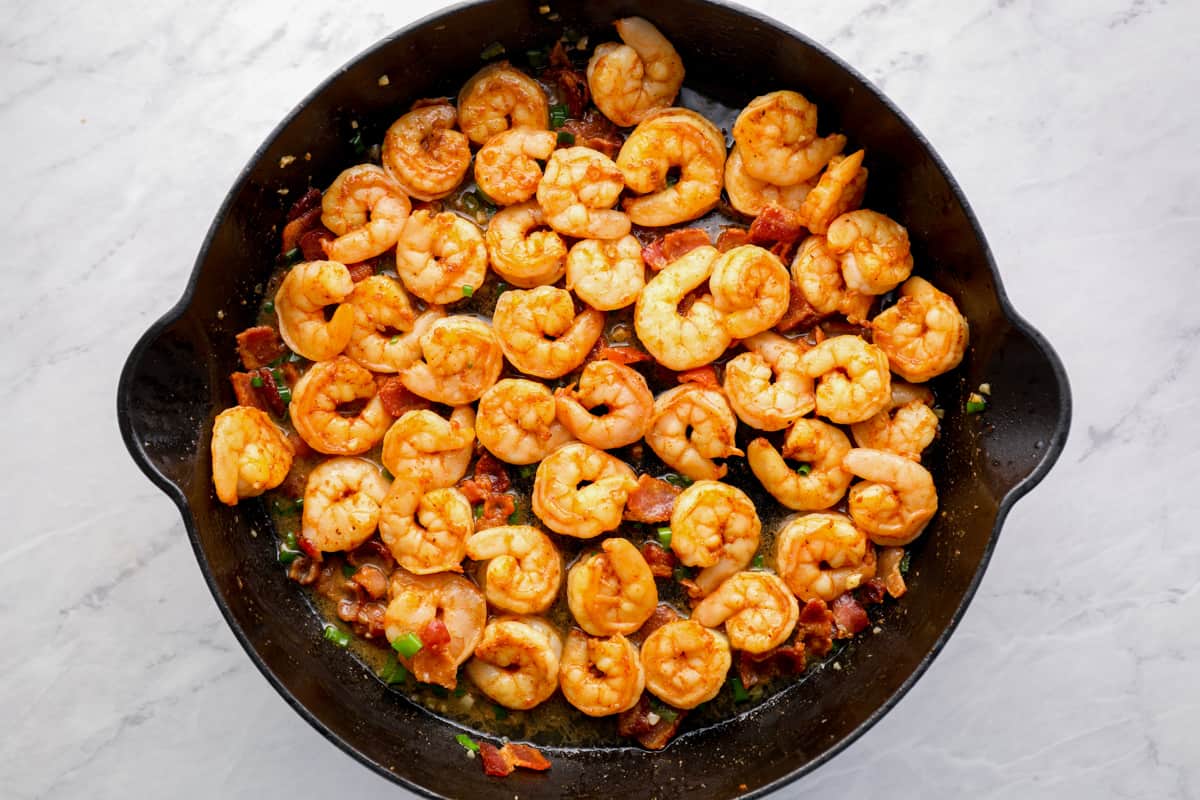 Cooking Cajun shrimp in a skillet.