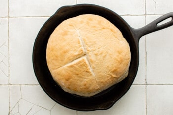 loaf of bread in a cast iron skillet