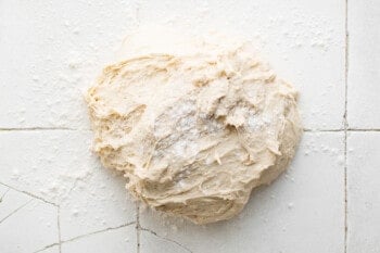 forming bread dough on a countertop