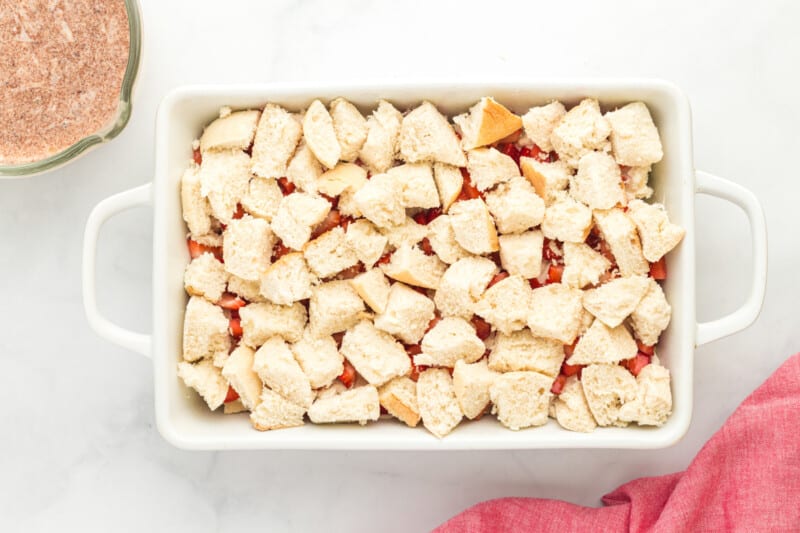 pieces of bread layered on top of a French toast casserole