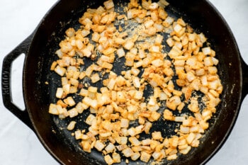 seasoned onions sautéing in a skillet