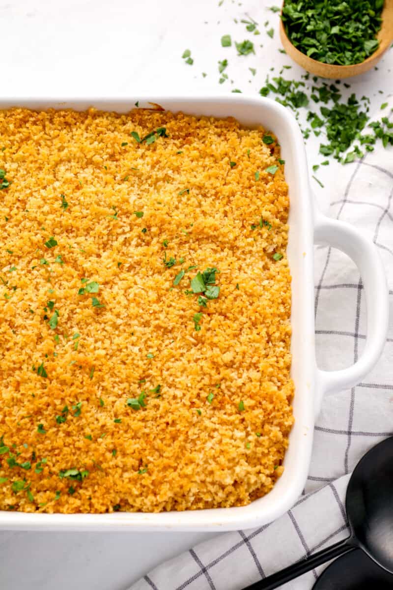 mac and cheese casserole in a white baking pan.
