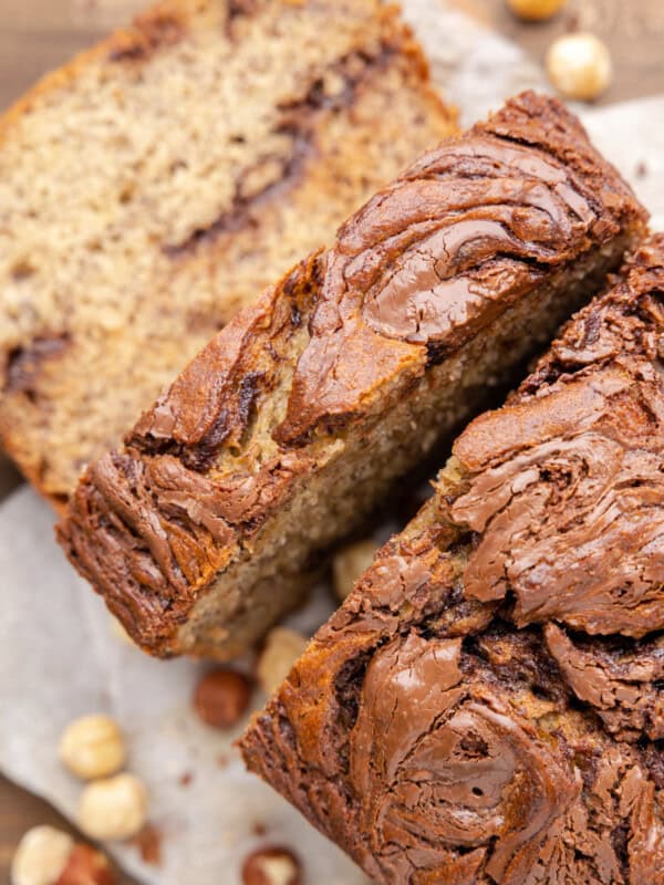 overhead view of sliced nutella banana bread with hazelnuts.