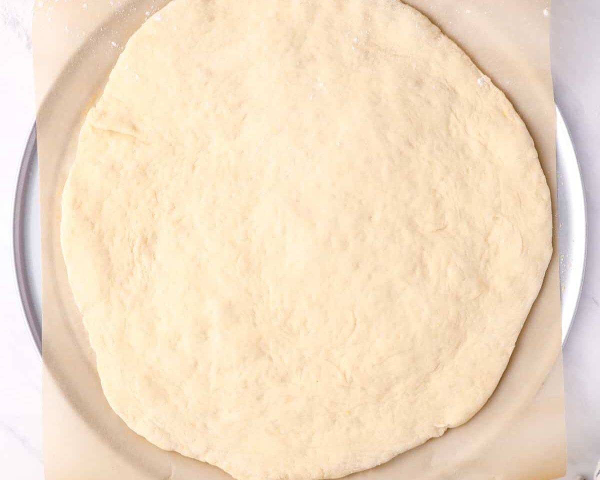 Rolled out pizza dough. - 10