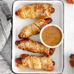 homemade pretzel dogs on a tray