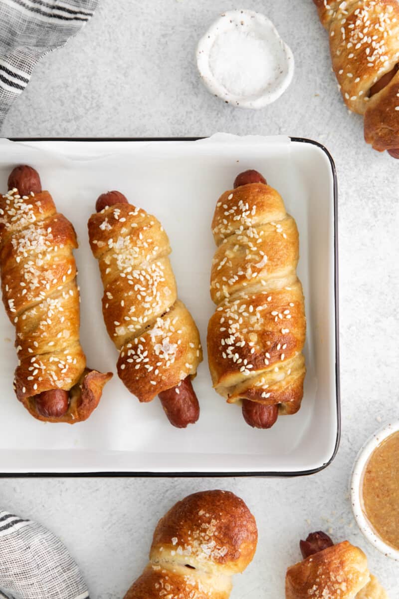 overhead view of pretzel dogs on a tray