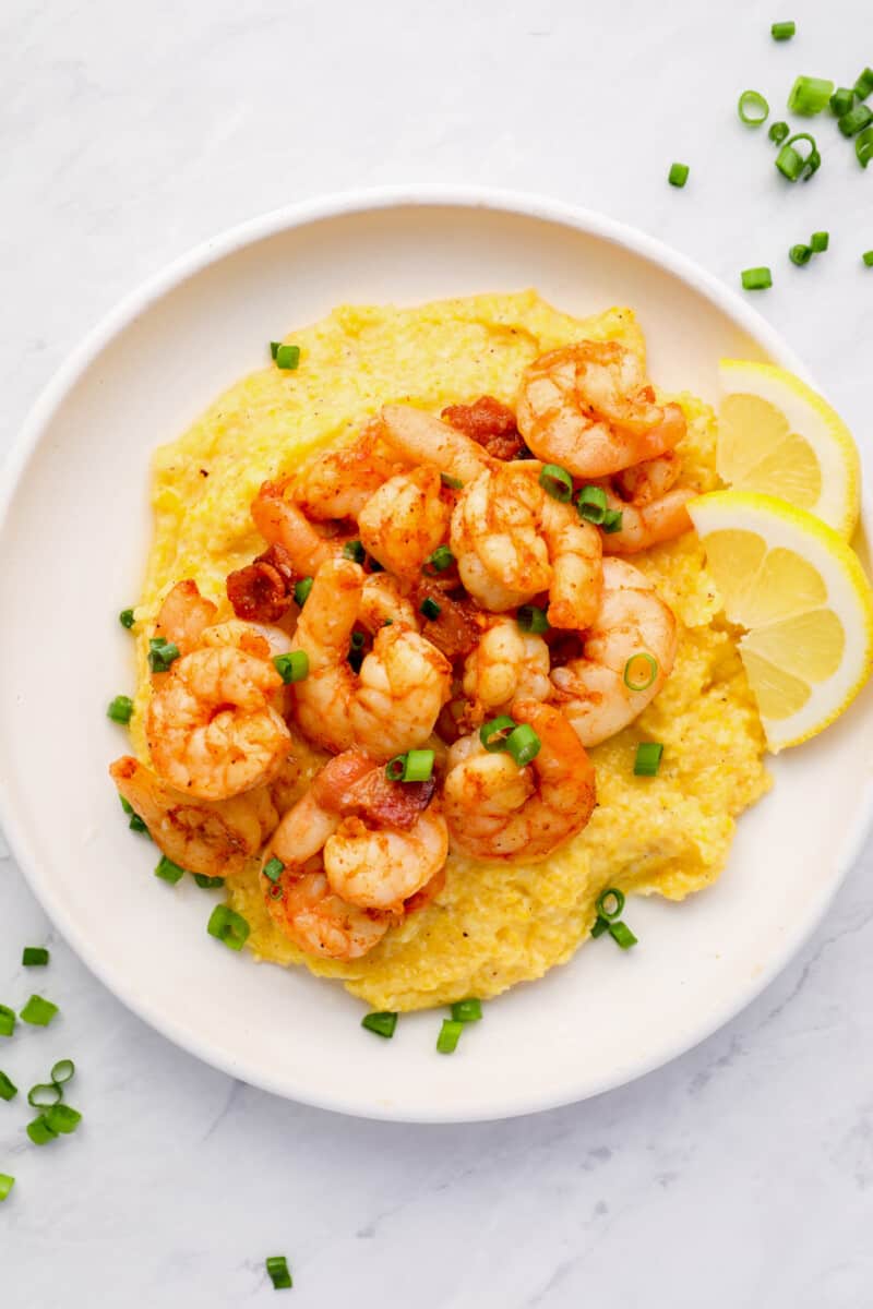 a plate of cheesy shrimp and grits