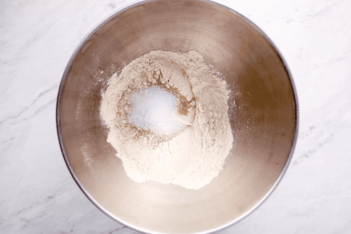 Bowl with dry ingredients to make pizza dough. - 7