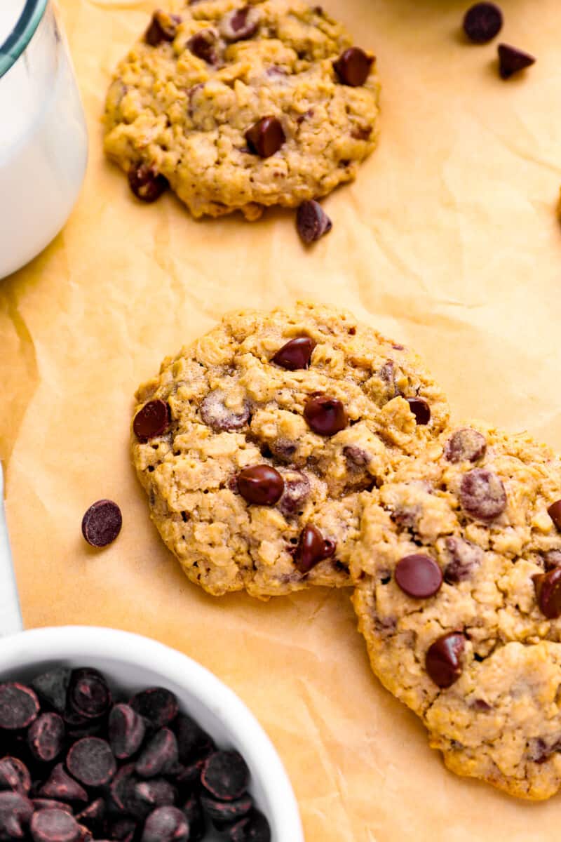 soft oatmeal chocolate chip cookies on parchment