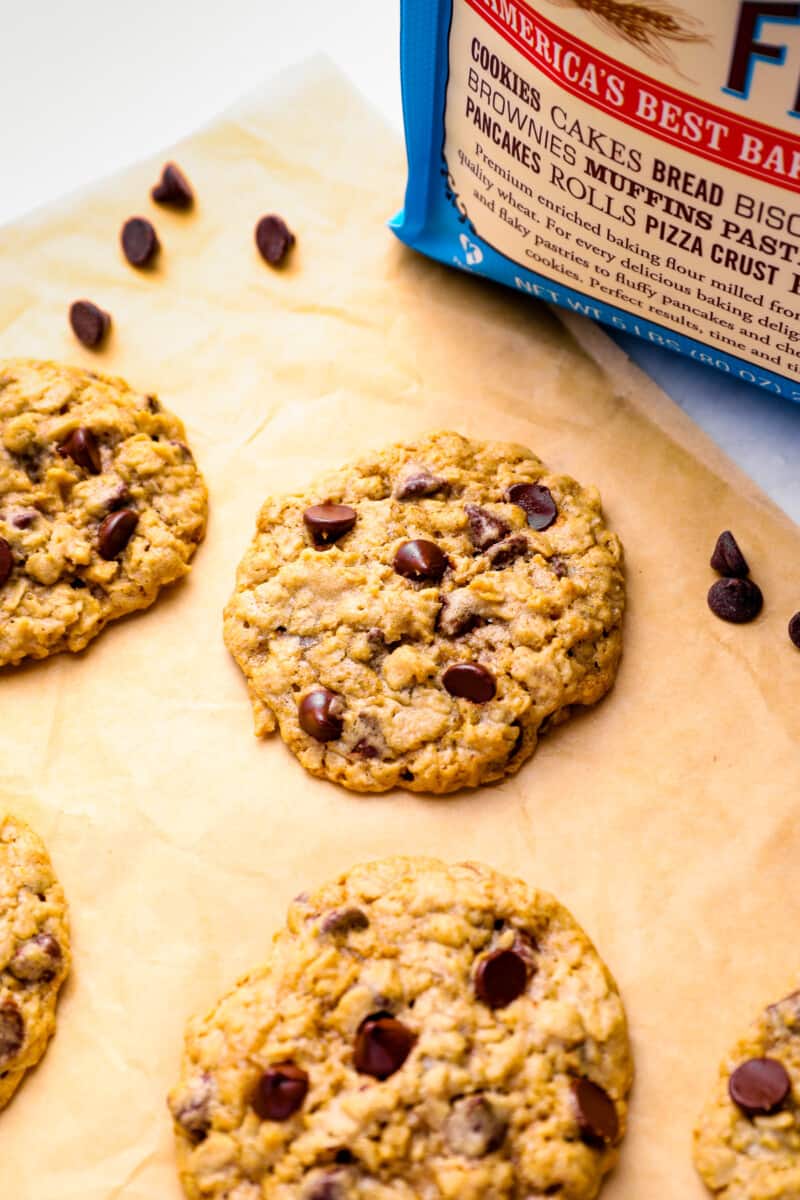 soft oatmeal chocolate chip cookies on parchment