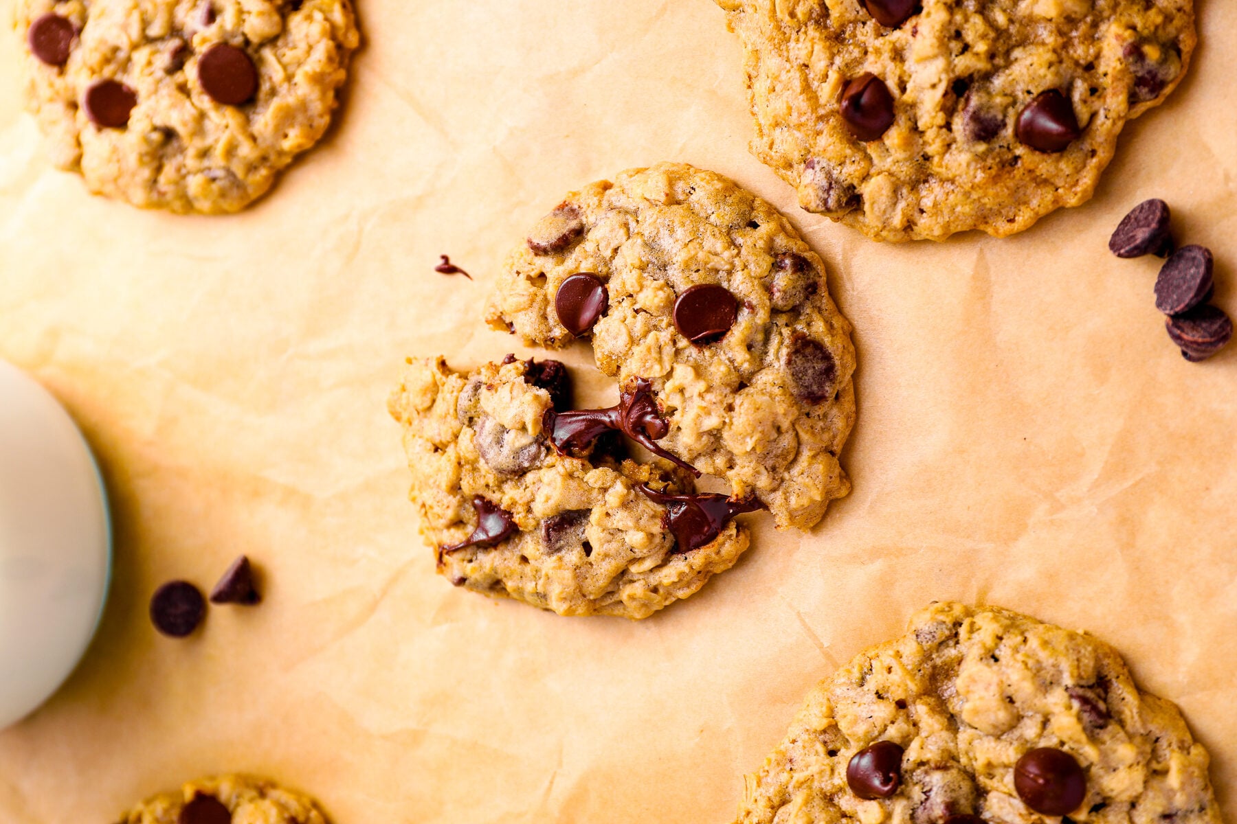 soft oatmeal chocolate chip cookies on parchment
