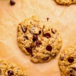 soft oatmeal chocolate chip cookies on parchment