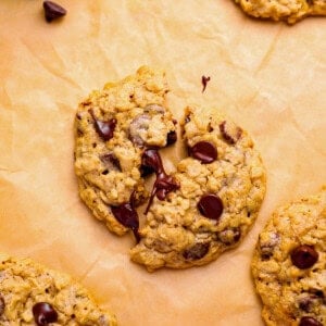 soft oatmeal chocolate chip cookies on parchment
