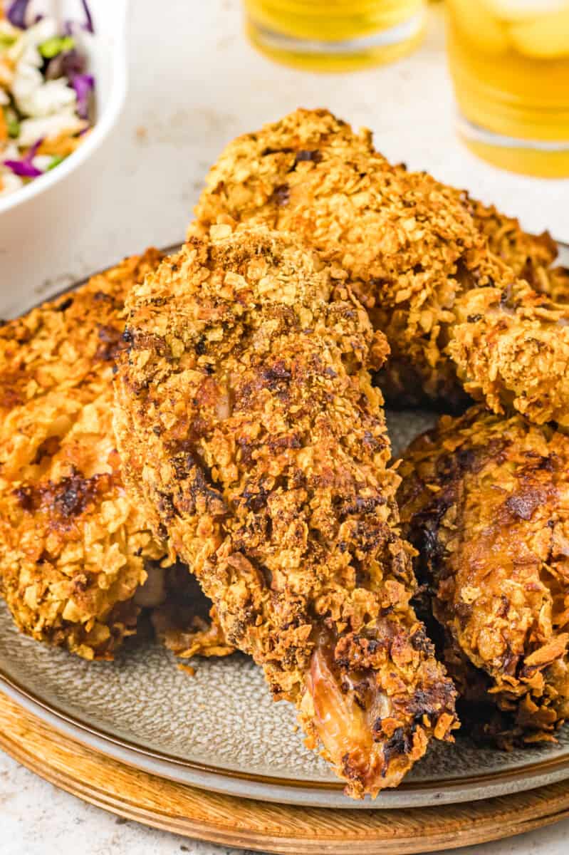 close up of air fryer fried chicken on a white plate.