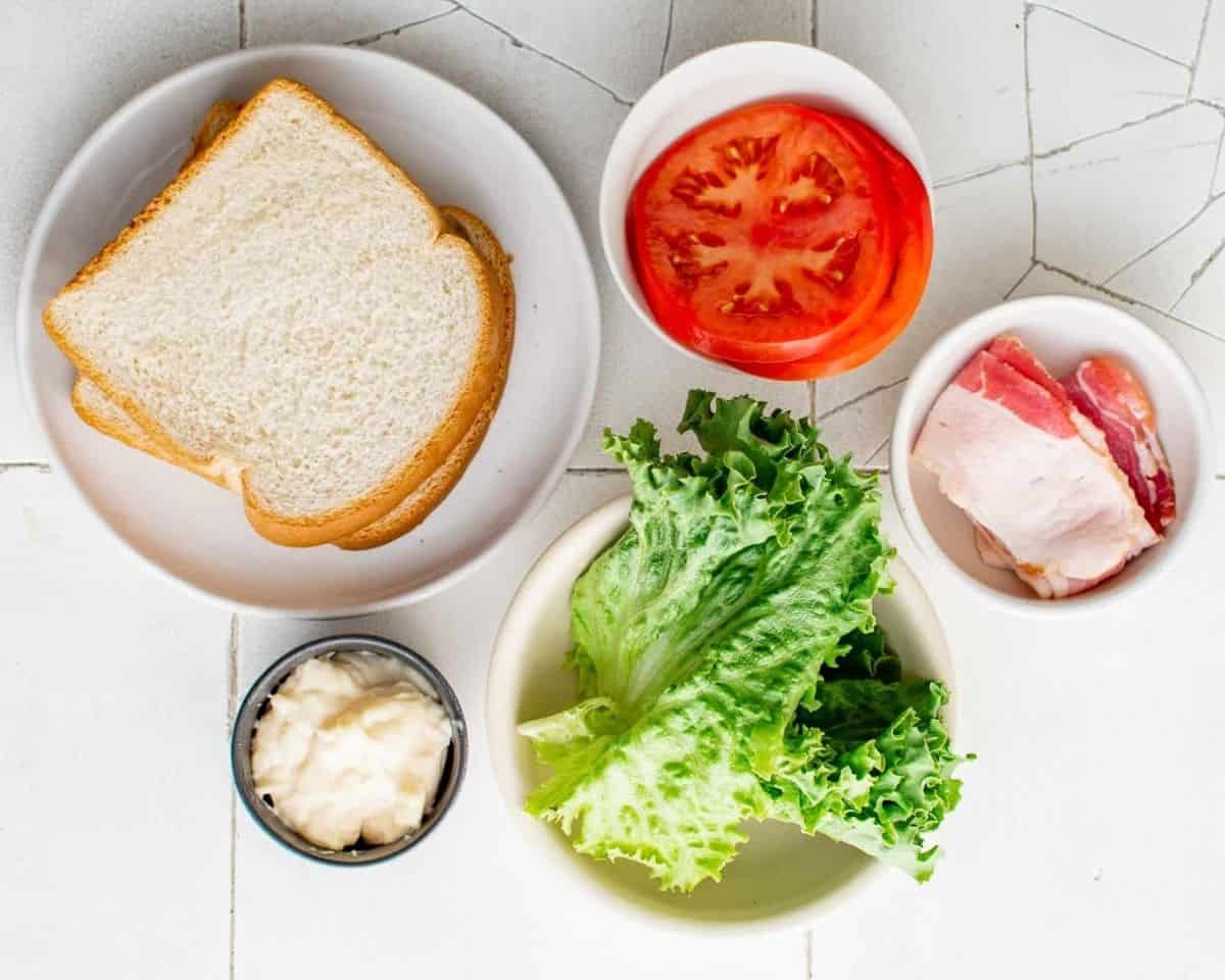 Ingredients to make a BLT sandwich.  - 6