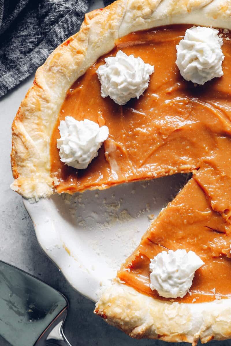 close up on caramel pie with whipped topping