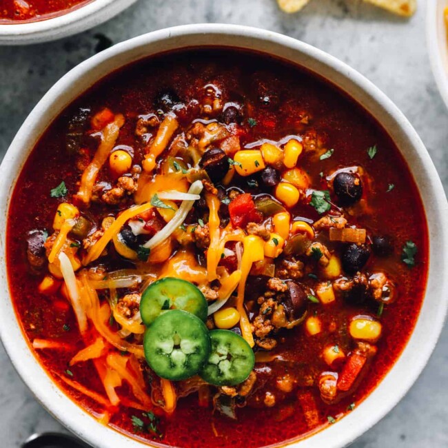 close up of crockpot taco soup in a white bowl.