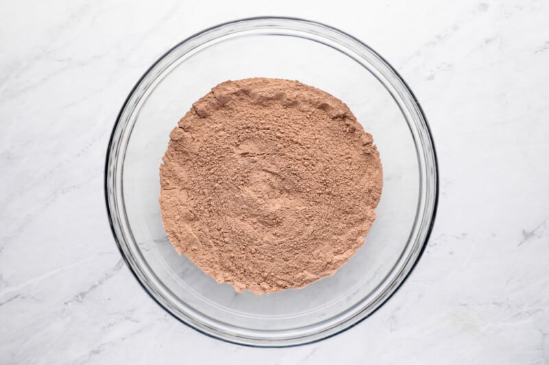 overhead view of dry ingredients for chocolate pound cake in a glass bowl.