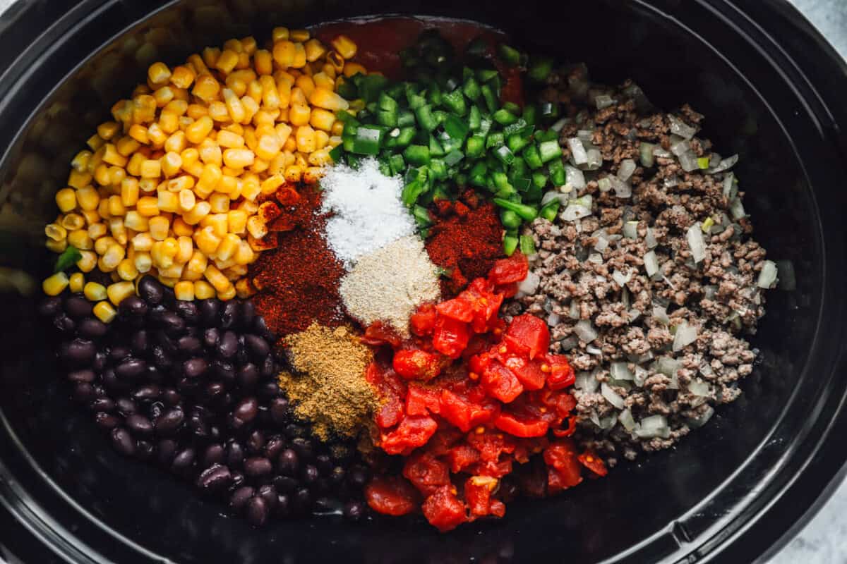 ingredients for crockpot taco soup in a crockpot.