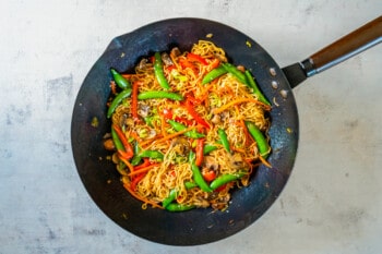 overhead view of vegetable lo mein in a wok.