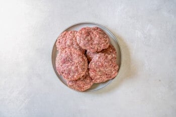 breakfast burger patties on a gray plate.