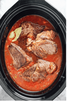 cooked beef chuck roast in a crockpot.