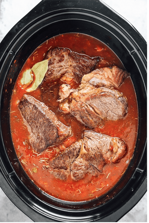 cooked beef chuck roast in a crockpot.