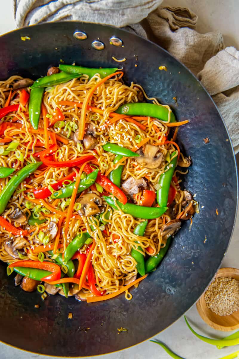 overhead view of vegetable lo mein in a wok.