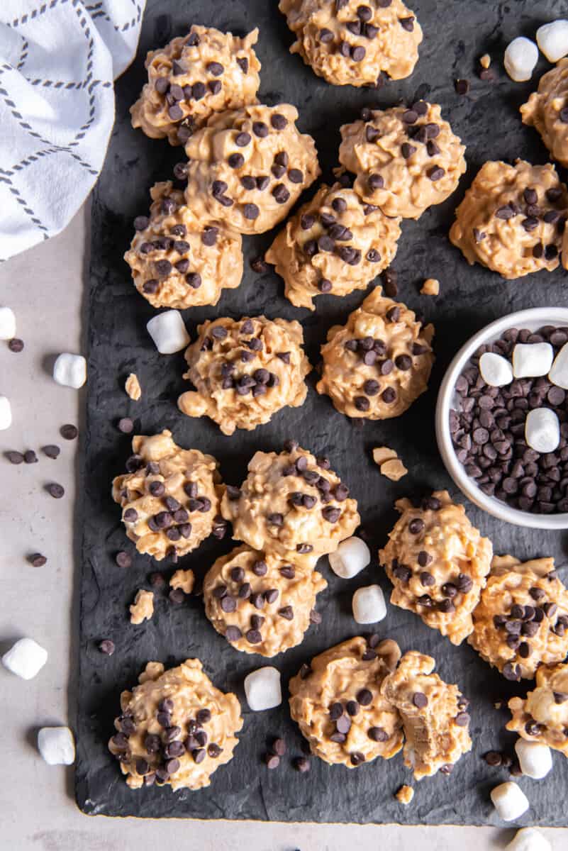 overhead view of a slate tray full of avalanche cookies with marshmallows and chocolate chips.