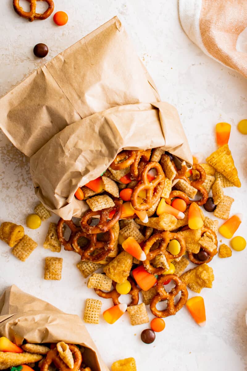 halloween snack mix pouring out of paper serving bag