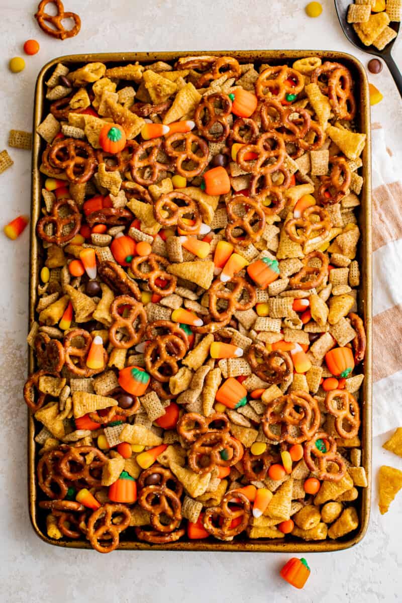 halloween Chex mix on a gold baking tray