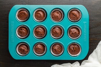 cupcake liners filled with batter, before baking