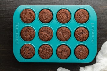 baked chocolate cupcakes in a cupcake tin