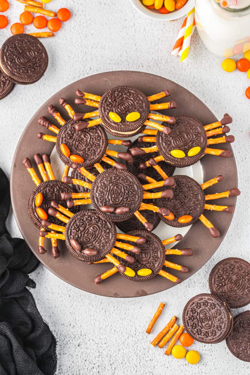 a serving platter piled up with oreo spiders