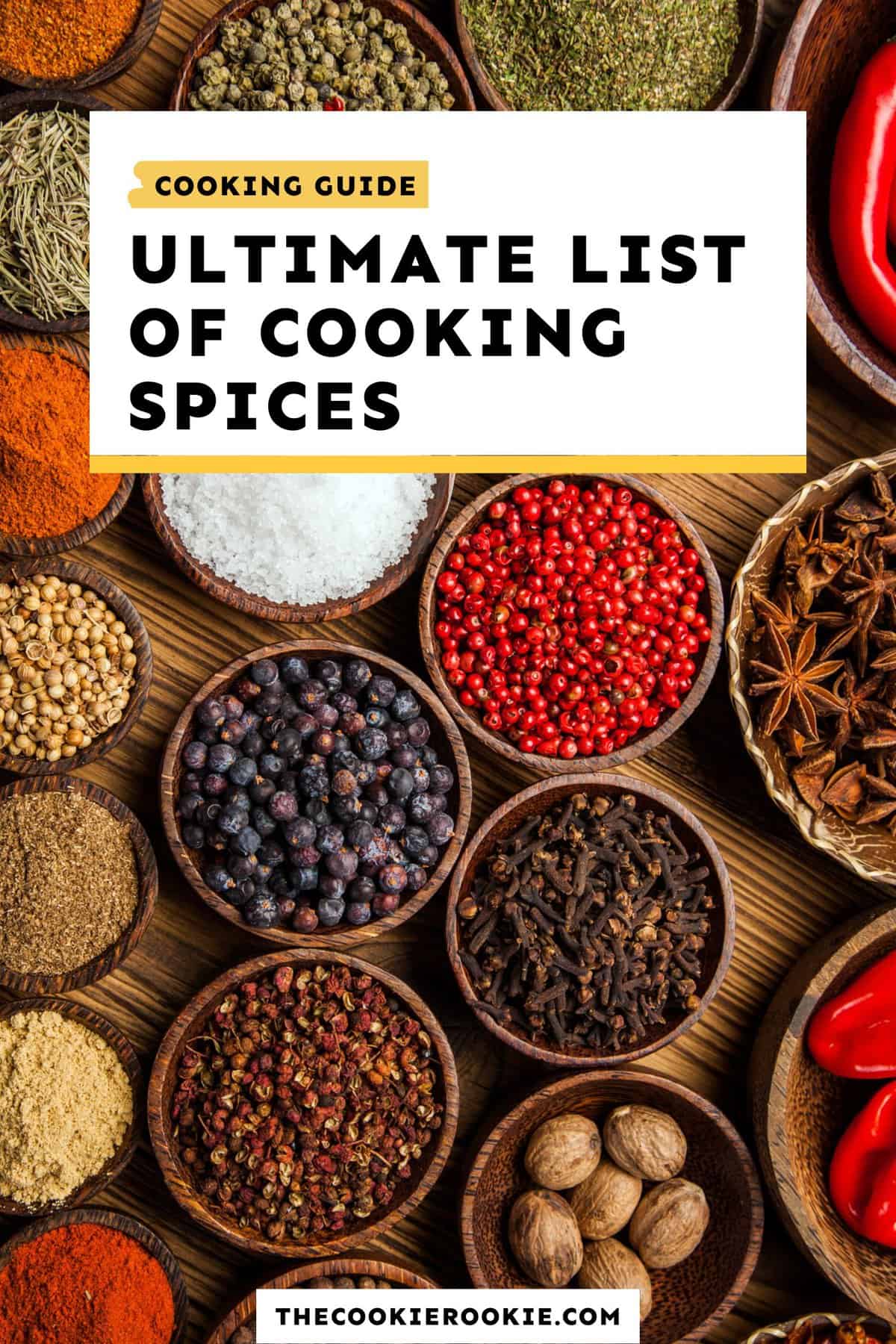 an array of fresh spices arranged in bowls on a wooden tabletop, with text overlay that reads: ultimate list of cooking spices.