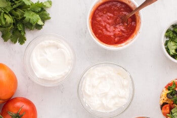 sour cream and salsa in glass bowls.