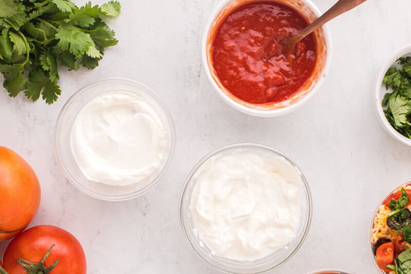 sour cream and salsa in glass bowls.