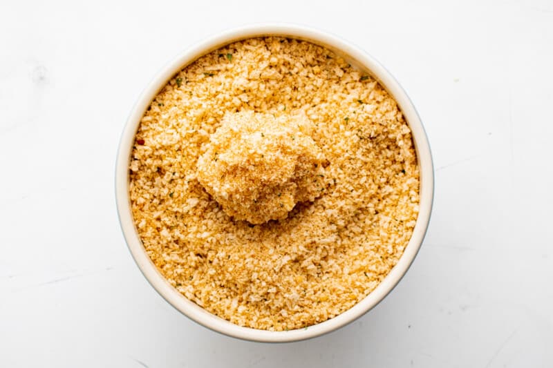 rolling Mac and cheese ball in breadcrumb mixture, before frying