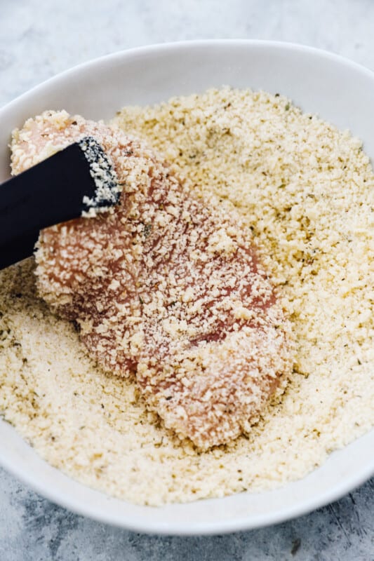 coating chicken breast in breadcrumbs